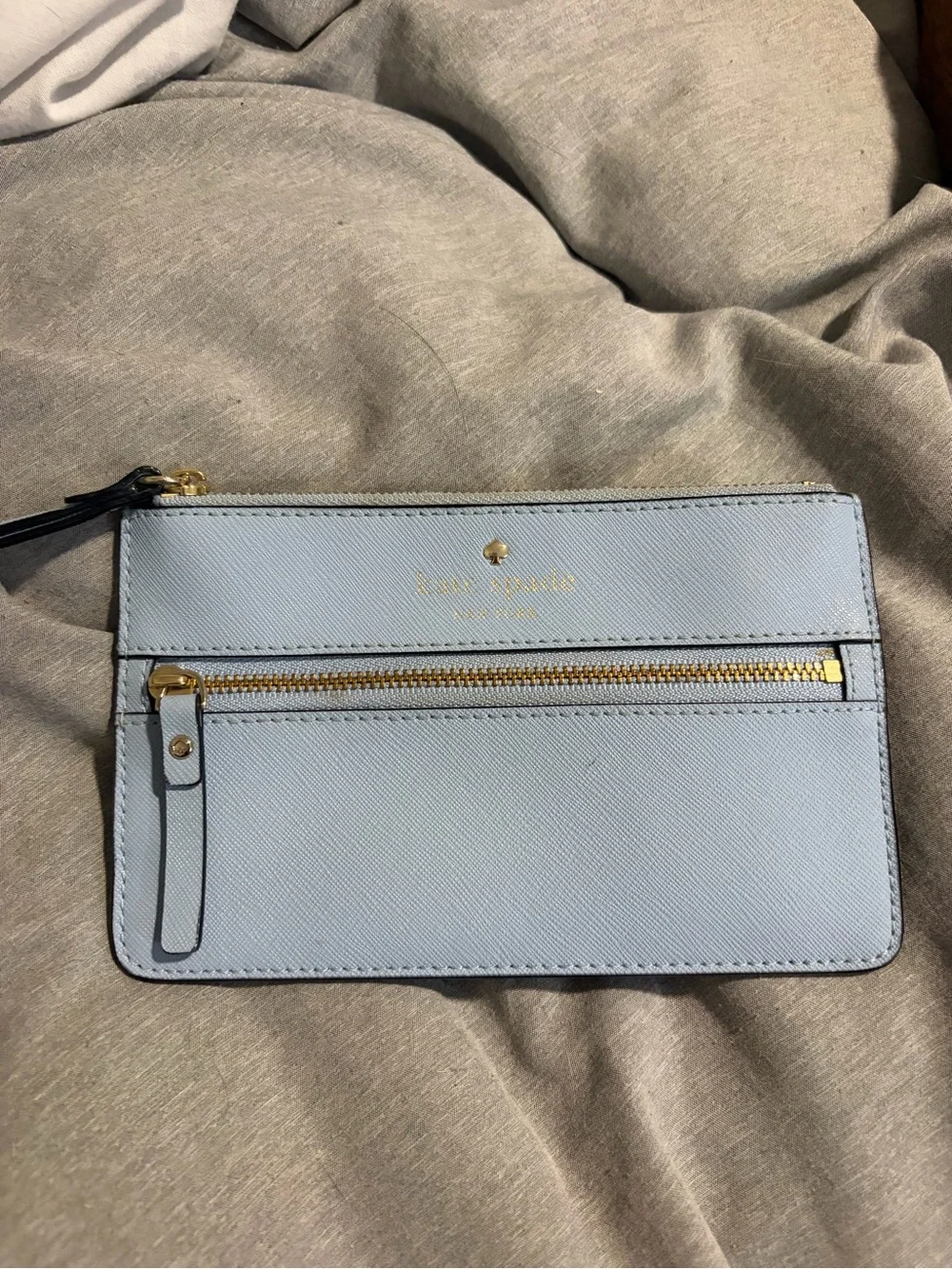 kate spade light blue leather zip wristlet with gold hardware